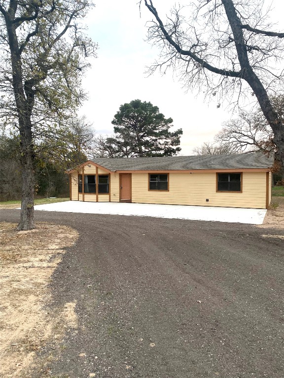 137 Road Runner Lane Bastrop, TX 78602 - Photo 2 of 20 a front view of a house with a yard and garage