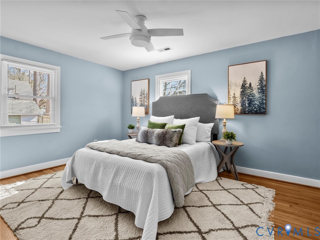 6715 Galaxie Road Henrico, VA 23228 - Photo 17 of 40 a bedroom with a bed and a painting on the wall