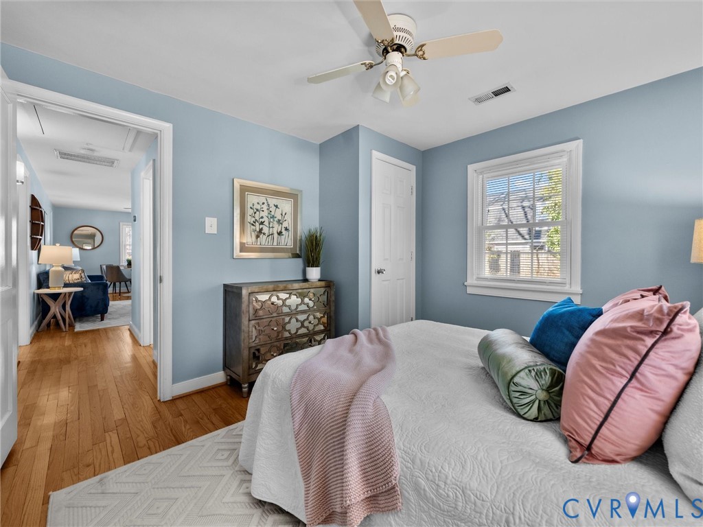 6715 Galaxie Road Henrico, VA 23228 - Photo 20 of 40 a bedroom with a bed and wooden floor