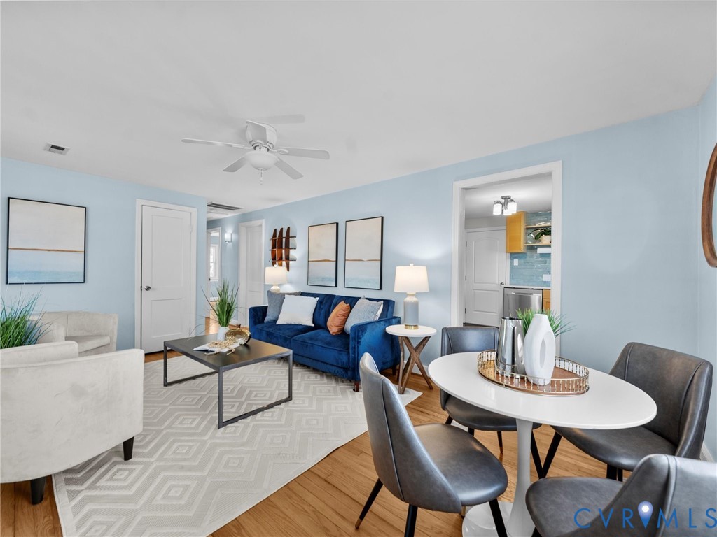 6715 Galaxie Road Henrico, VA 23228 - Photo 3 of 40 a living room with furniture and wooden floor