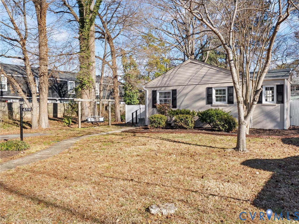 6715 Galaxie Road Henrico, VA 23228 - Photo 33 of 40 a front view of a house with garden