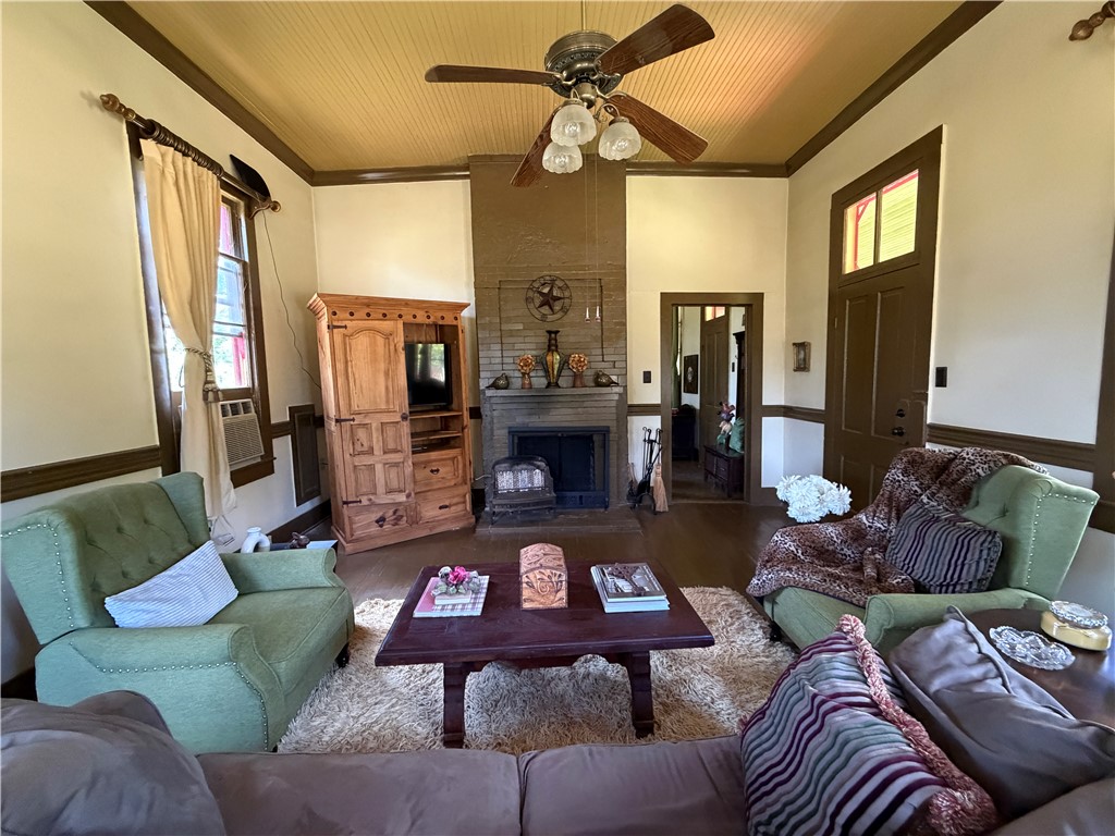 1100 Maple Calvert, TX 77837 - Photo 16 of 32 a living room with furniture and a fireplace