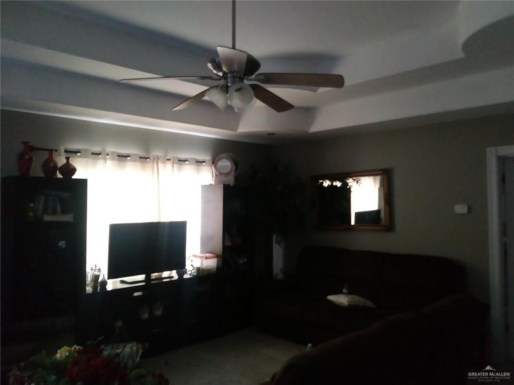 12705 East Monte Cristo Road Edinburg, TX 78542 - Photo 11 of 16 a view of a livingroom with furniture window and a ceiling fan