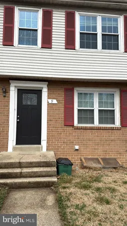 a front view of a house with stairs