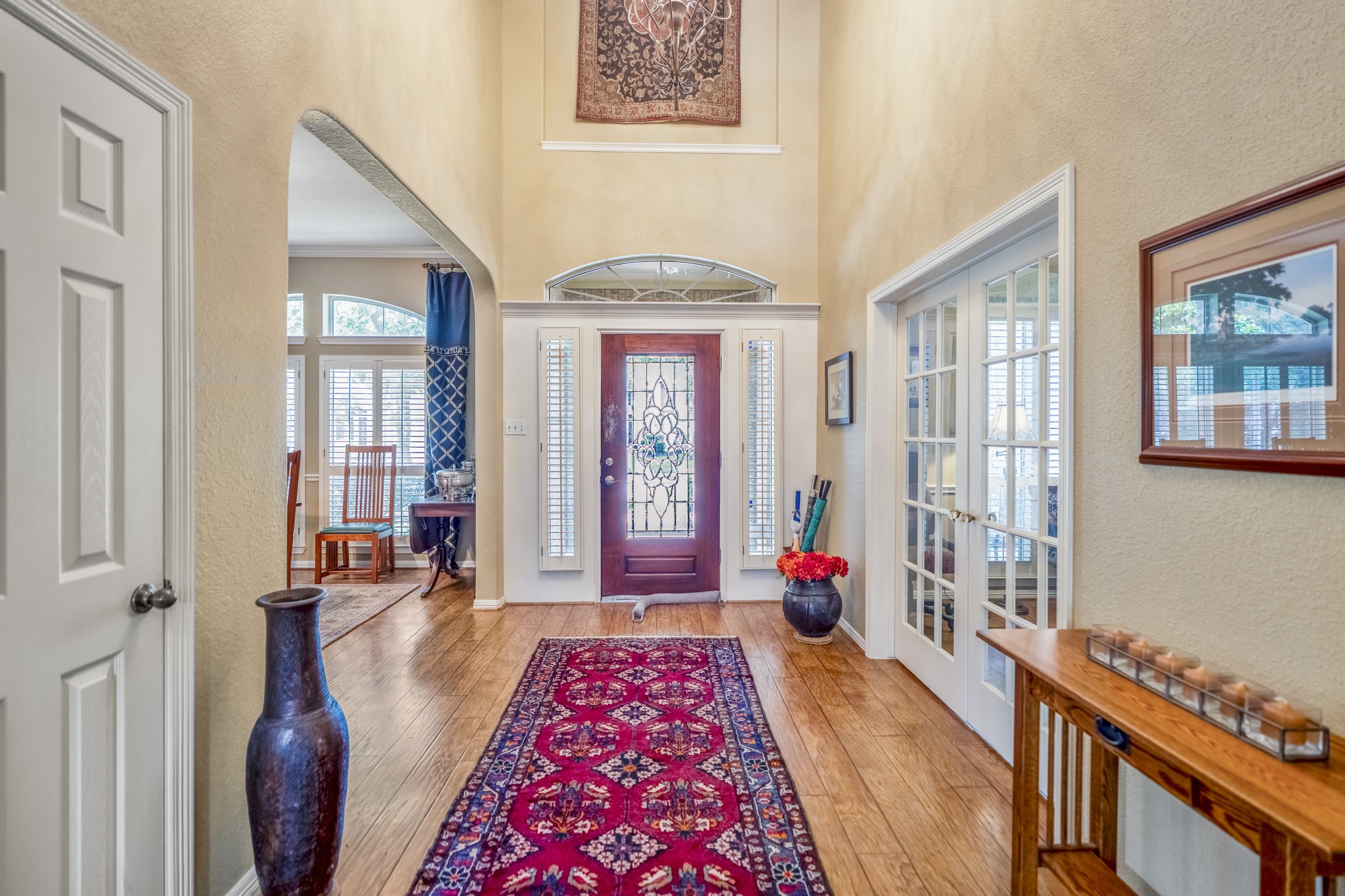 1438 Hatchmere Place Spring, TX 77379 - Photo 6 of 50 Looking back towards the front door you see the natural light streaming into the home that reflects beautifully on the gleaming wood floors.