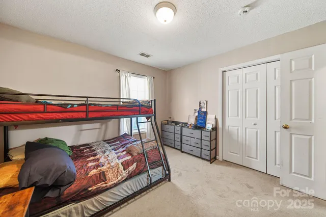 a bathroom with a toilet a sink and a mirror