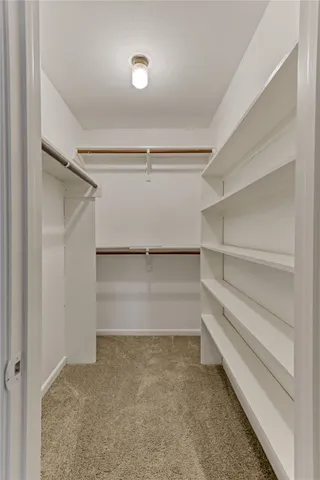 a view of an empty walk in closet