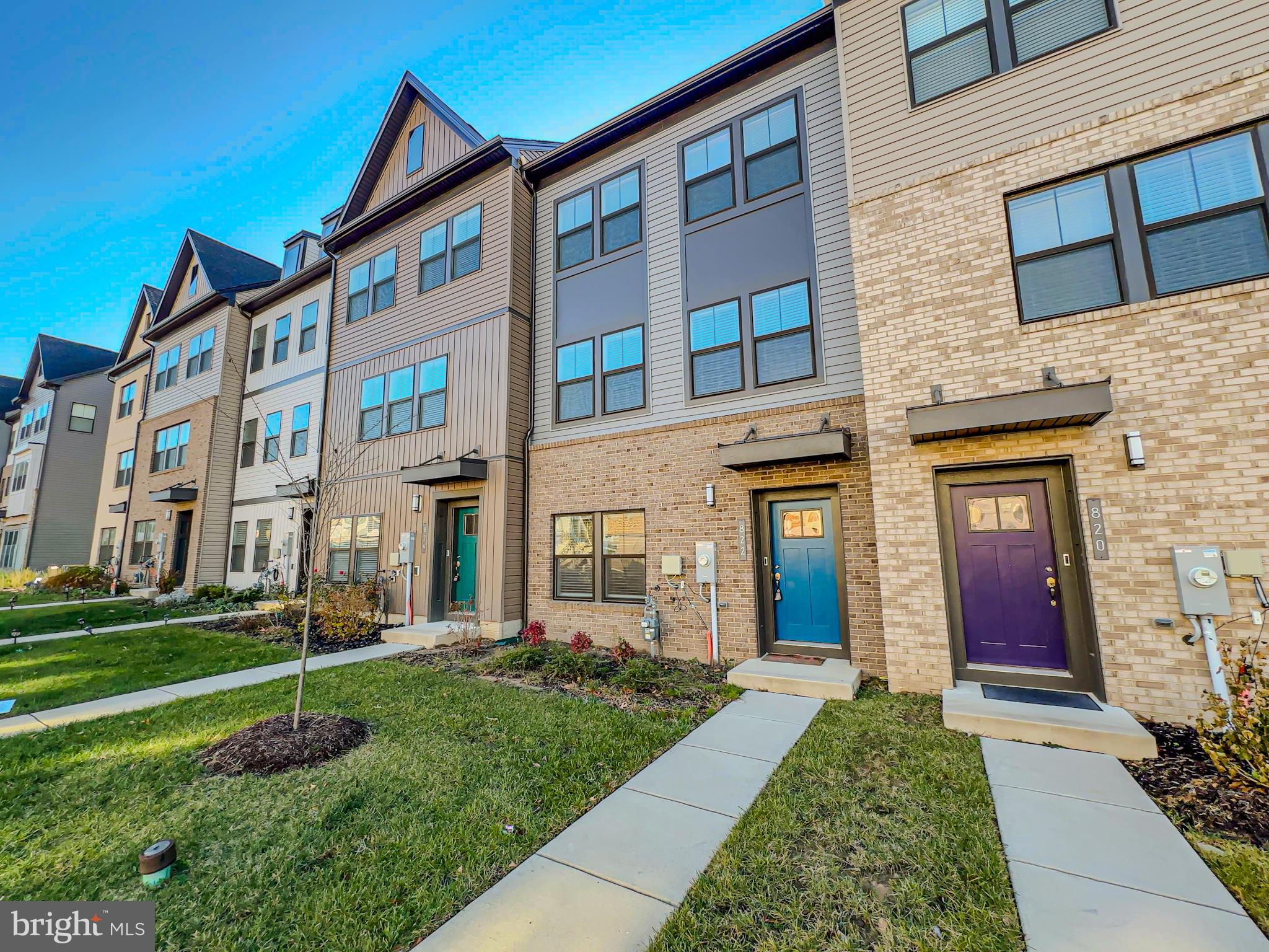 822 Teacher MItchell Road Glen Burnie, MD 21060 - Photo 2 of 53 front view of a brick house with a yard