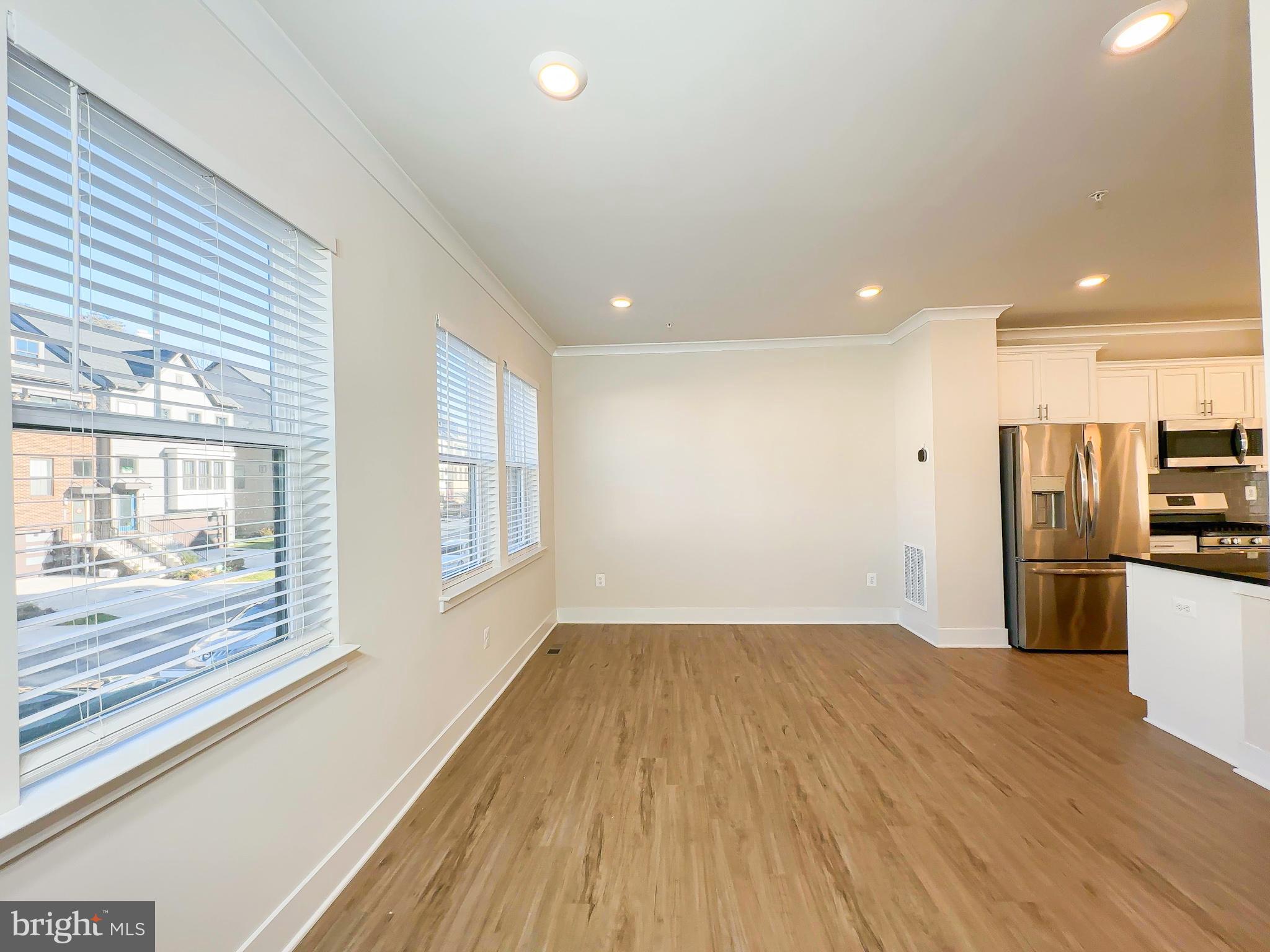 822 Teacher MItchell Road Glen Burnie, MD 21060 - Photo 21 of 53 a view of a kitchen with wooden floor and a kitchen
