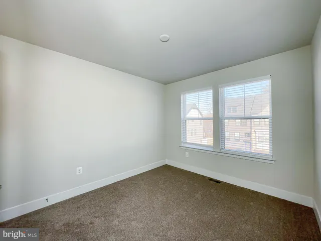a bathroom with a sink a toilet a mirror and shower