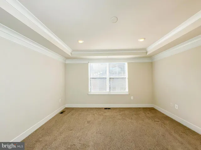 a bathroom with a granite countertop sink a mirror and shower
