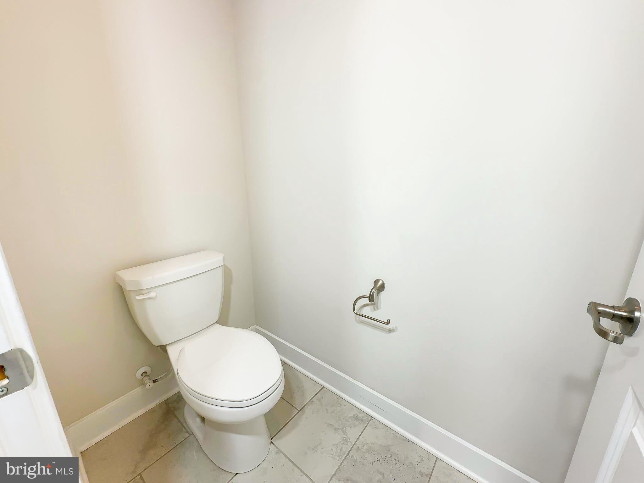 822 Teacher MItchell Road Glen Burnie, MD 21060 - Photo 32 of 53 a white toilet sitting next to a white sink