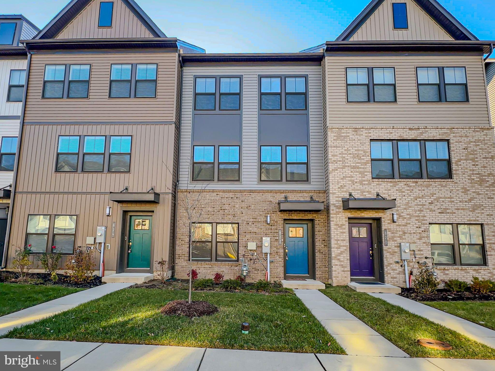 822 Teacher MItchell Road Glen Burnie, MD 21060 - Photo 41 of 53 a front view of a brick house with a yard