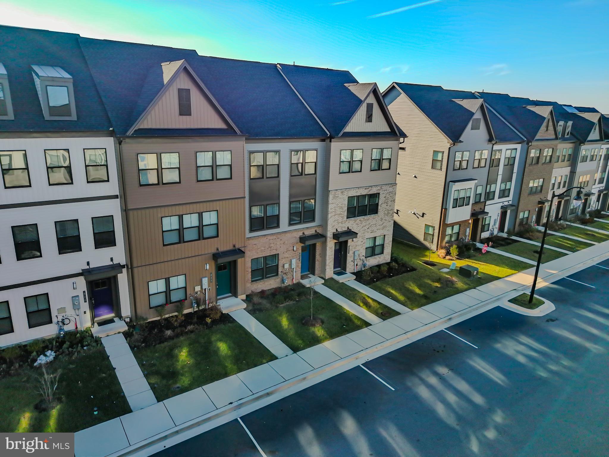 822 Teacher MItchell Road Glen Burnie, MD 21060 - Photo 42 of 53 a front view of residential houses with street