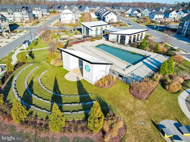 a view of a patio with table and chairs with wooden floor and fence