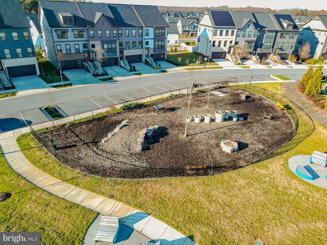 a view of a house with a garage and yard