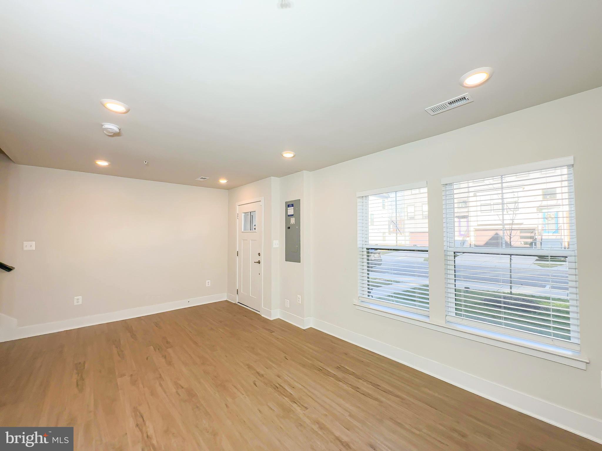 822 Teacher MItchell Road Glen Burnie, MD 21060 - Photo 6 of 53 a view of empty room with wooden floor and fan