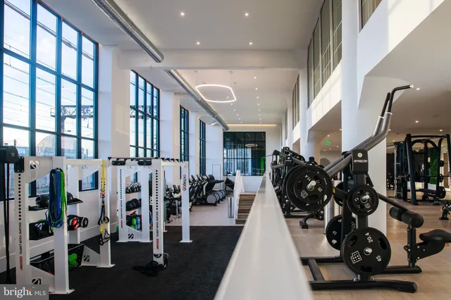 a very nice looking living room with lots of gym equipment