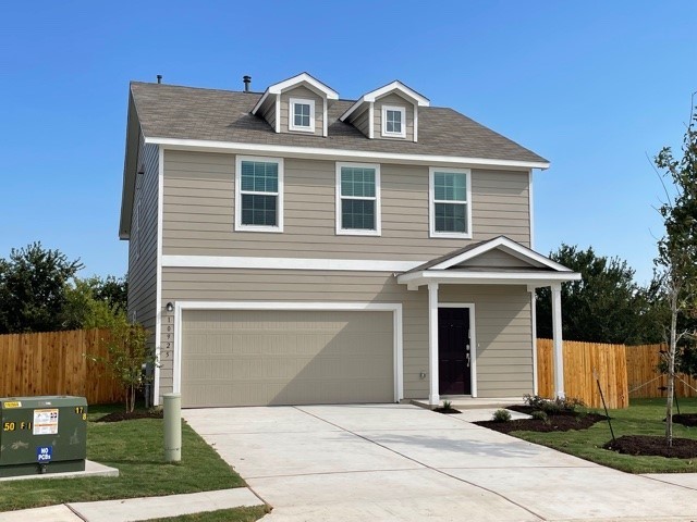 a front view of a house with yard