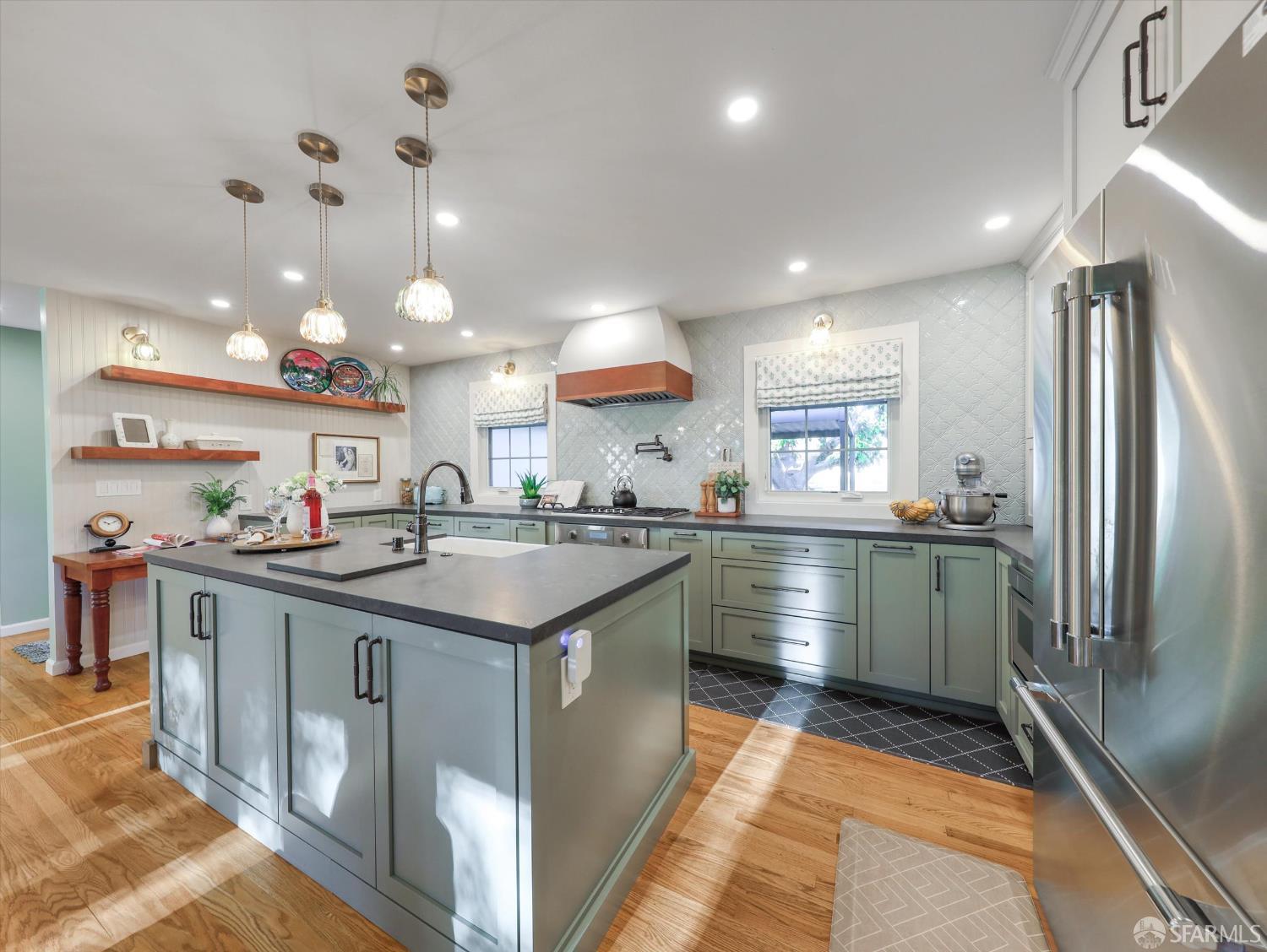 1773 Pinetree Court Concord, CA 94521 - Photo 14 of 37 a kitchen with counter top space cabinets and stainless steel appliances