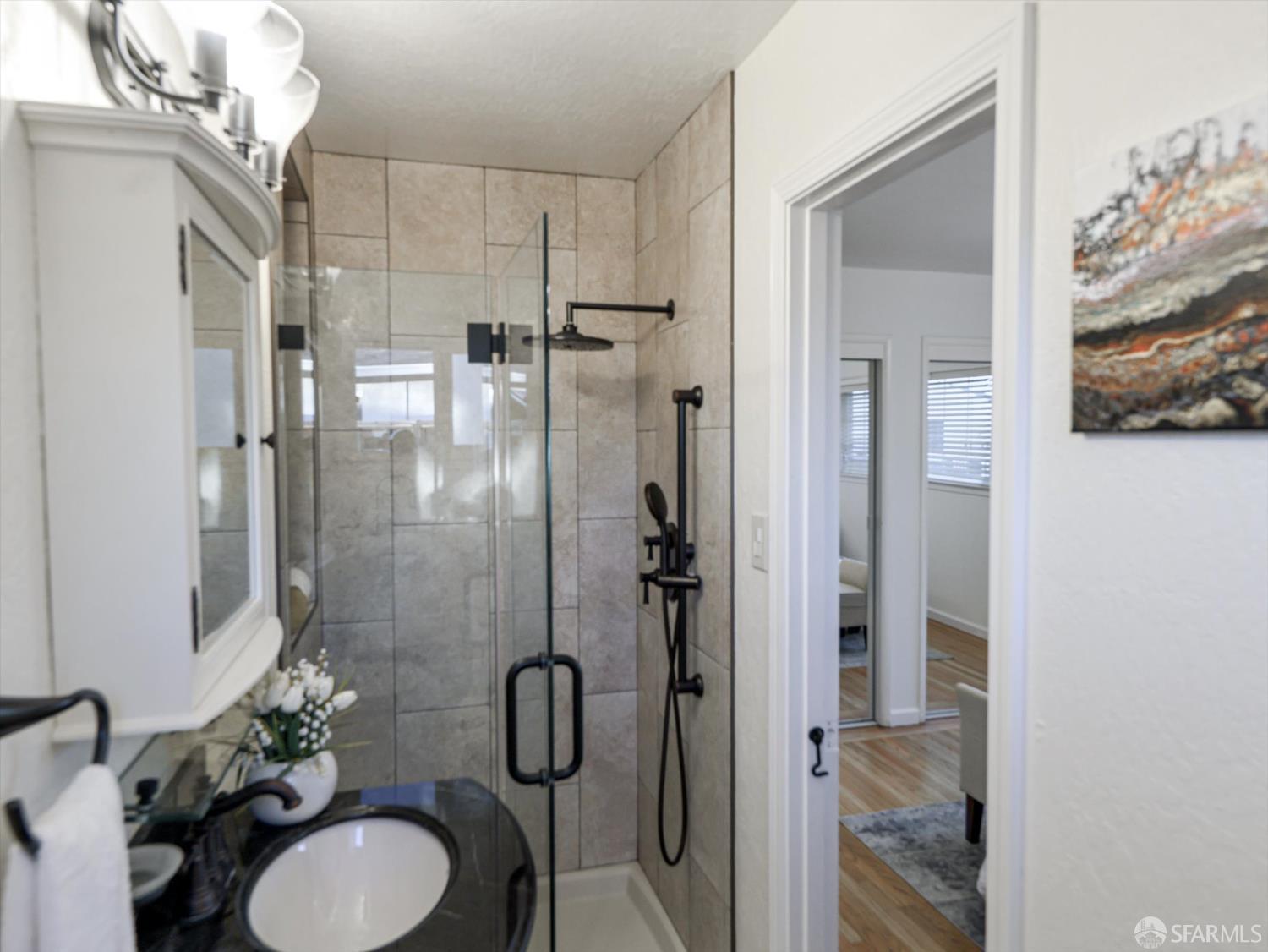 1773 Pinetree Court Concord, CA 94521 - Photo 18 of 37 a bathroom with a sink toilet and shower