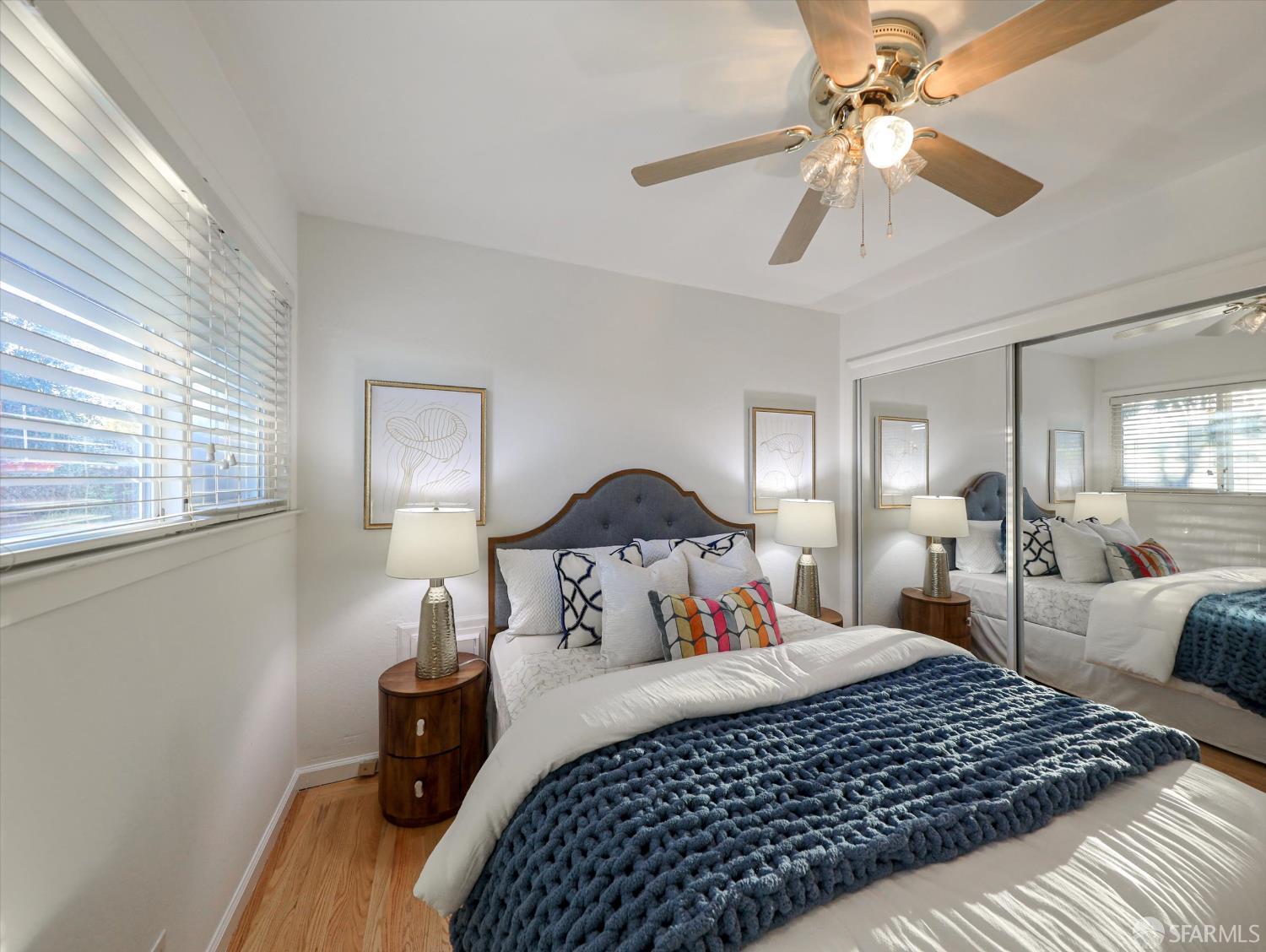 1773 Pinetree Court Concord, CA 94521 - Photo 20 of 37 a bedroom with a large bed and a chandelier