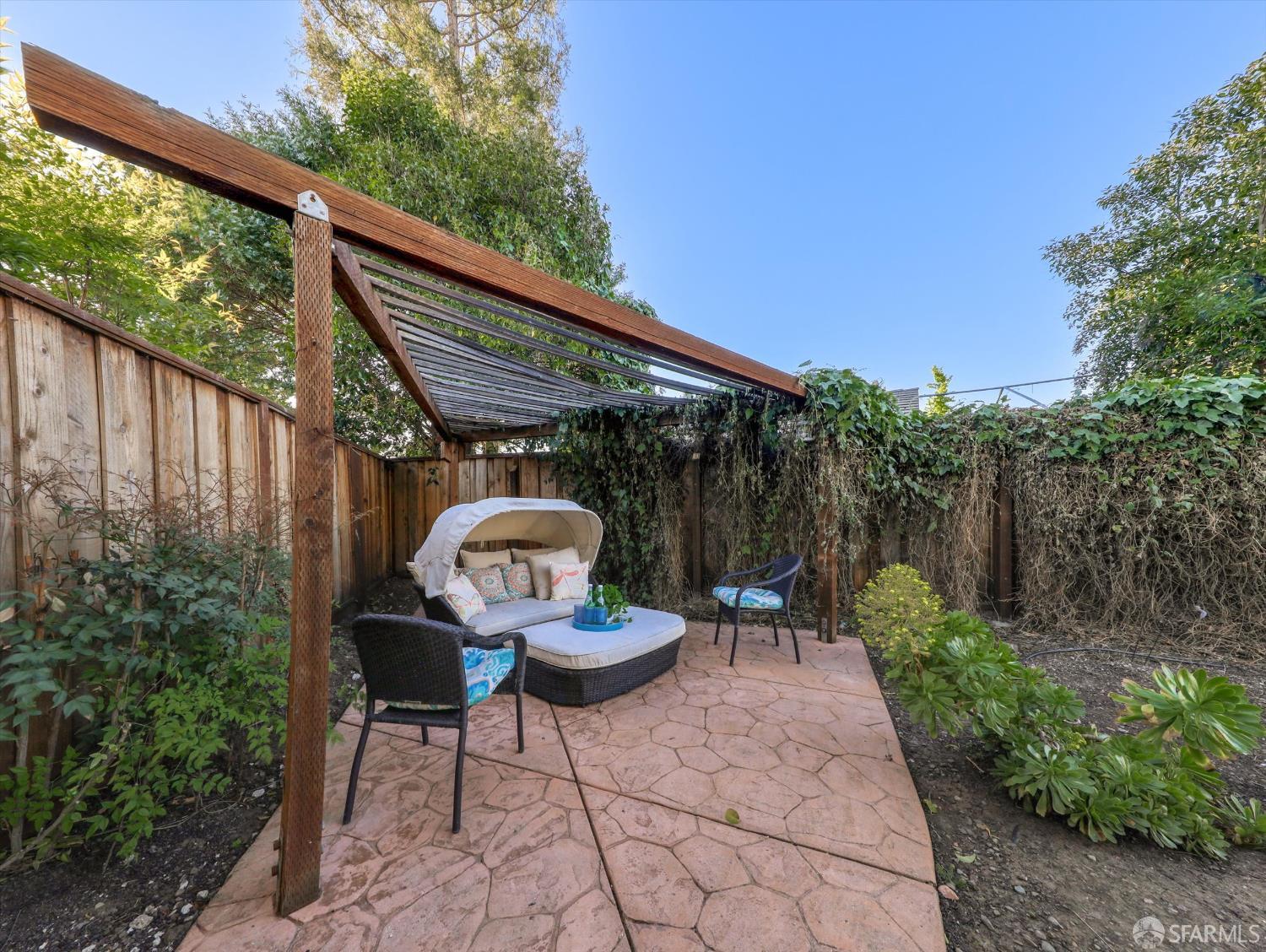 1773 Pinetree Court Concord, CA 94521 - Photo 31 of 37 a view of a chairs and table in backyard of the house