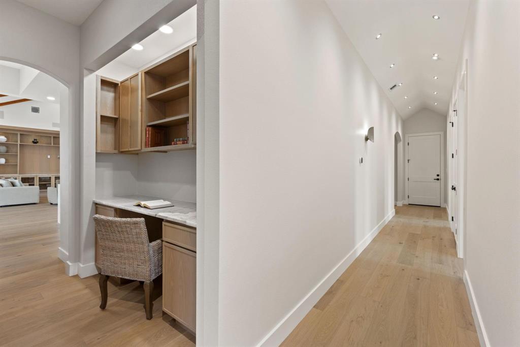 6505 County Road 1126B Godley, TX 76044 - Photo 12 of 39 Hall with arched walkways, recessed lighting, lightwood-style floors, a desk, and lofted ceiling