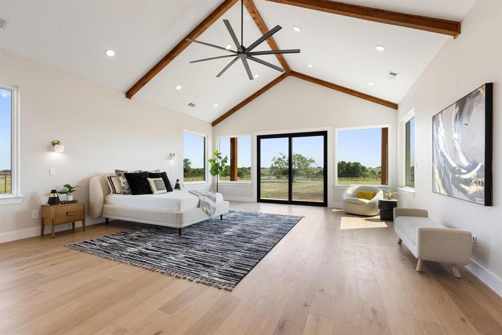6505 County Road 1126B Godley, TX 76044 - Photo 15 of 39 Bedroom with beam ceiling, high vaulted ceiling,access to exterior, light wood-type flooring, andrecessed lighting