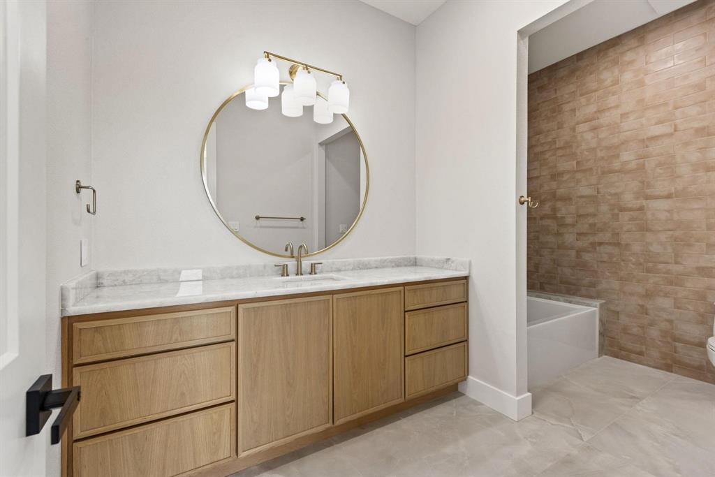 6505 County Road 1126B Godley, TX 76044 - Photo 26 of 39 Full bathroom featuring vanity, shower / bathtubcombination, and light tile patterned floors