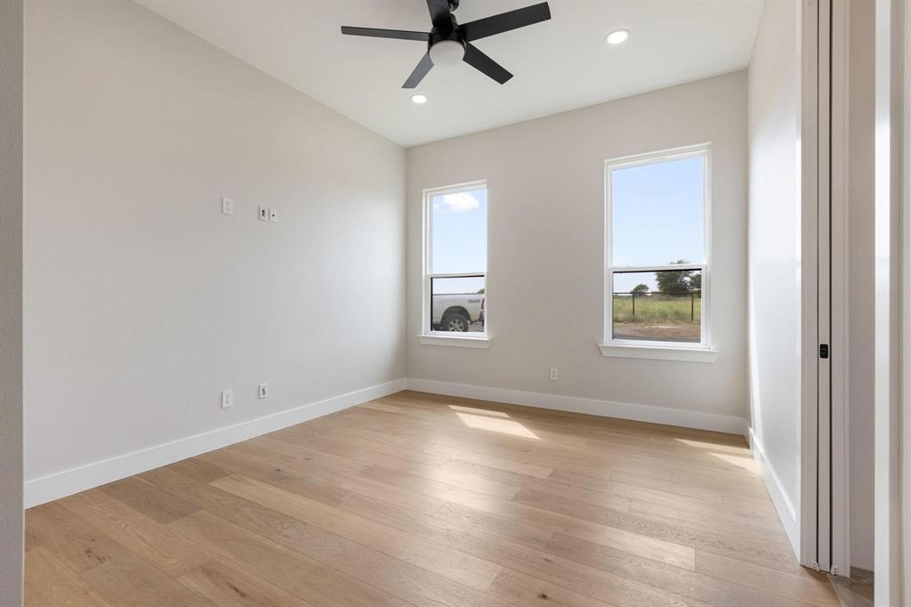 6505 County Road 1126B Godley, TX 76044 - Photo 28 of 39 Empty room featuring light wood-type flooring, aceiling fan, and recessed lighting