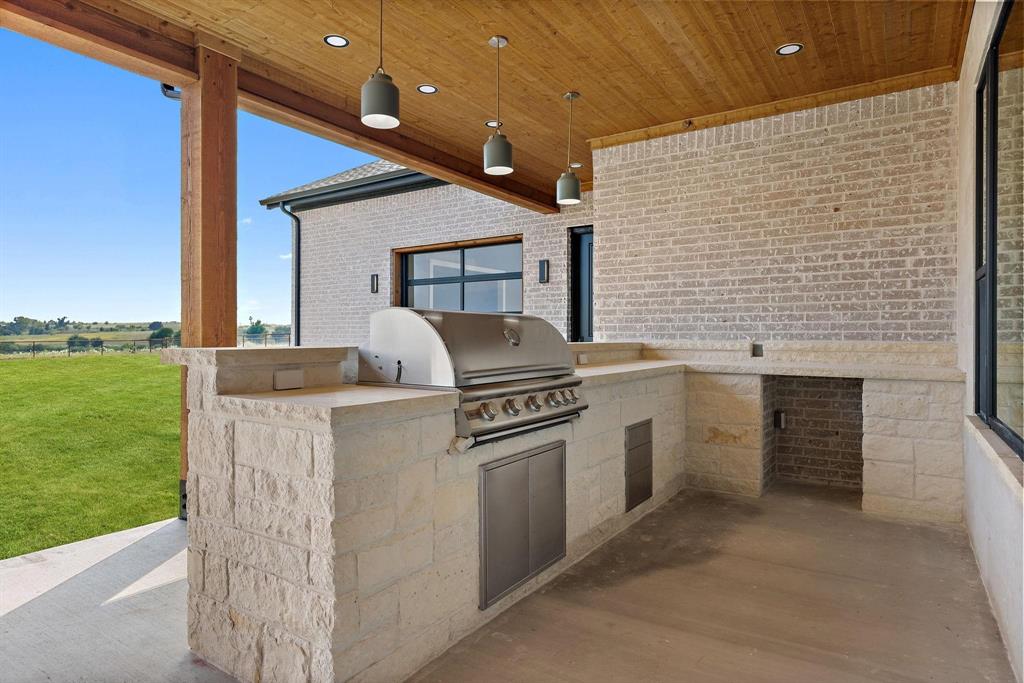 6505 County Road 1126B Godley, TX 76044 - Photo 34 of 39 View of patio with an outdoor kitchen