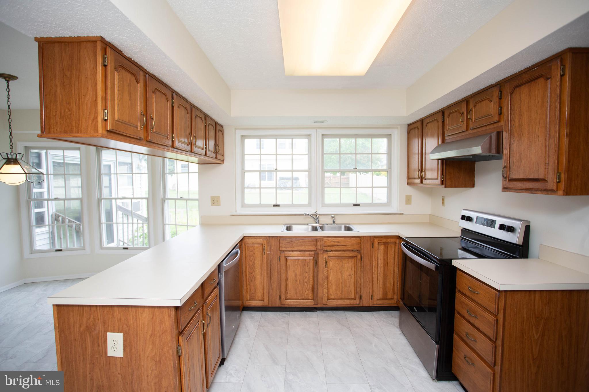143 Rambling Road Lumberton, NJ 08048 - Photo 12 of 54 a kitchen that has a sink and a stove in it