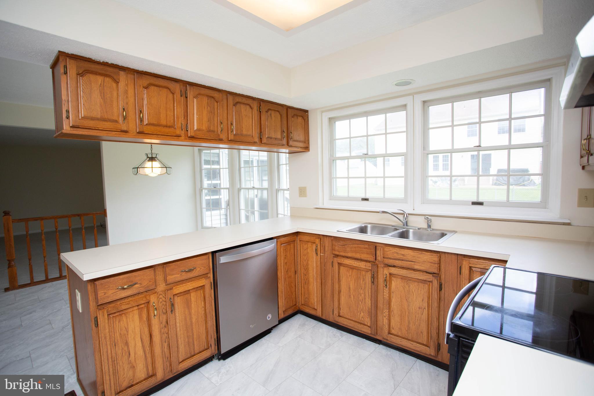 143 Rambling Road Lumberton, NJ 08048 - Photo 13 of 54 a kitchen with stainless steel appliances granite countertop a sink and cabinets