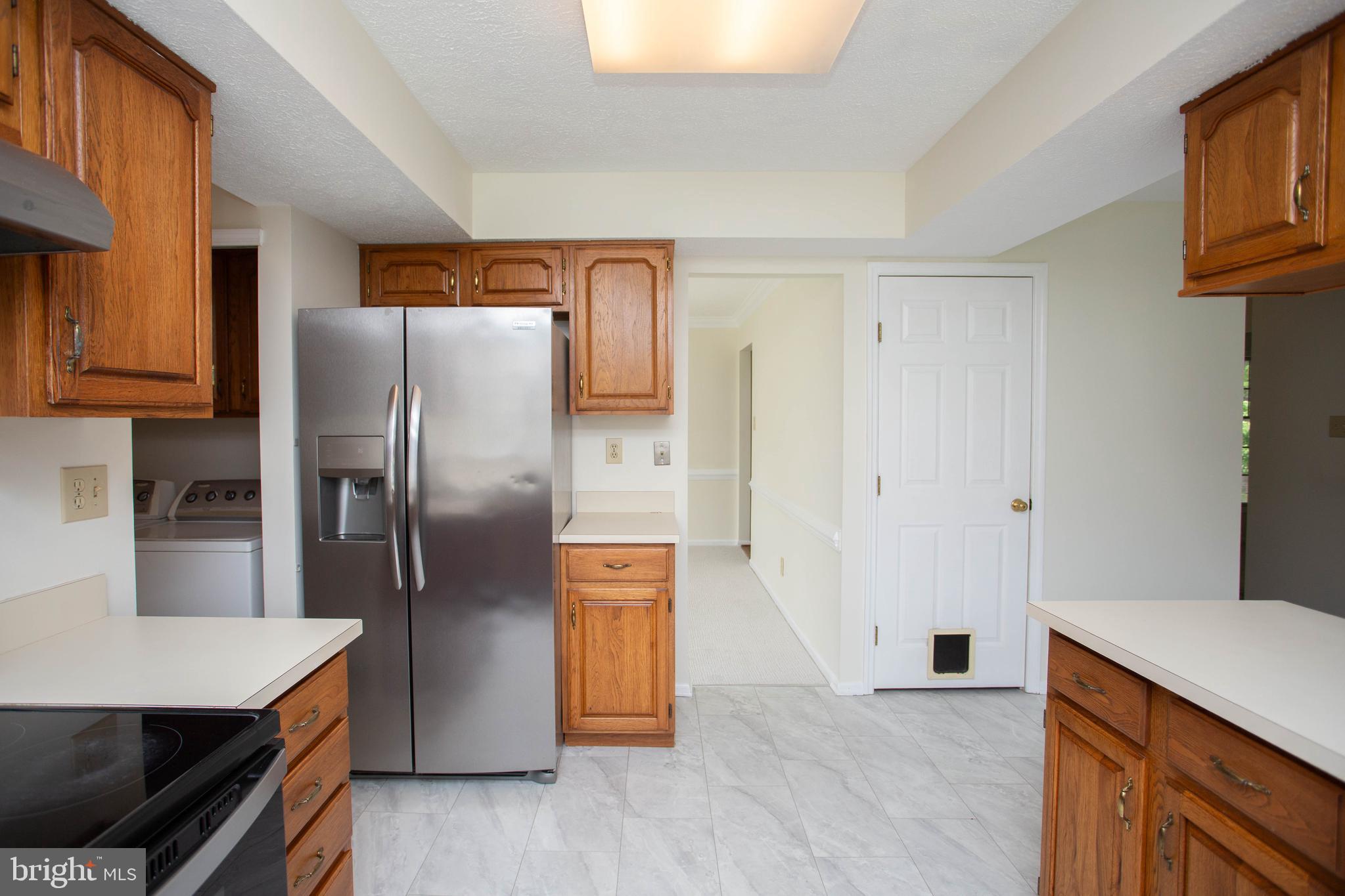 143 Rambling Road Lumberton, NJ 08048 - Photo 14 of 54 a kitchen with stainless steel appliances a refrigerator and a stove