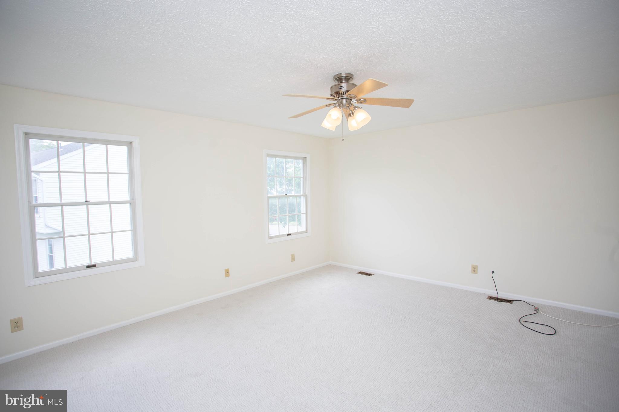 143 Rambling Road Lumberton, NJ 08048 - Photo 22 of 54 an empty room with windows and fan