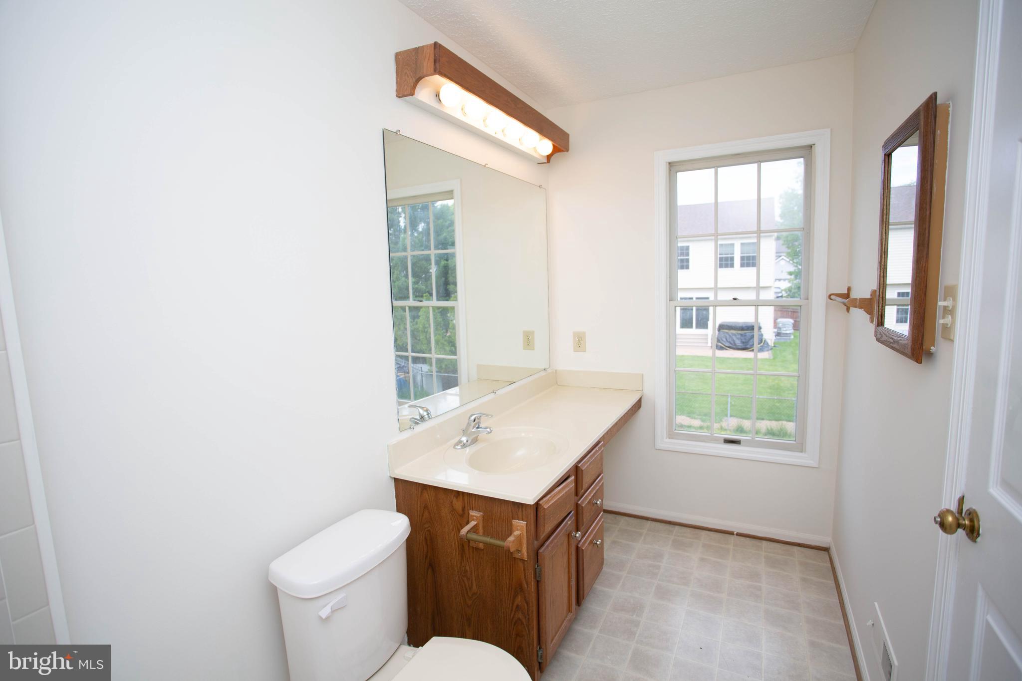 143 Rambling Road Lumberton, NJ 08048 - Photo 25 of 54 a room with a toilet a sink and a window