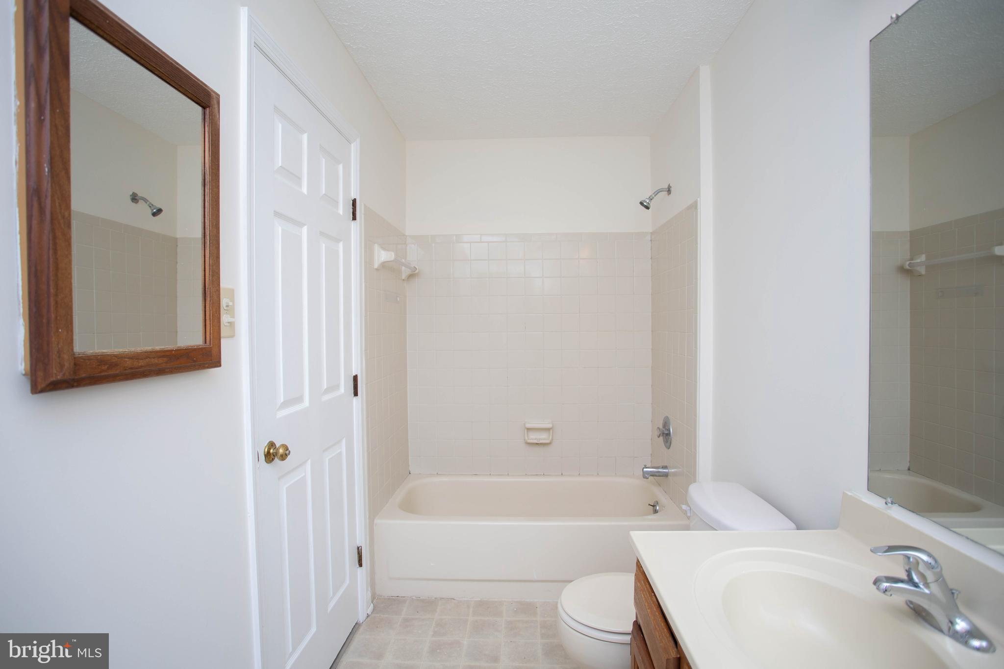 143 Rambling Road Lumberton, NJ 08048 - Photo 26 of 54 a bathroom with a sink a toilet and shower