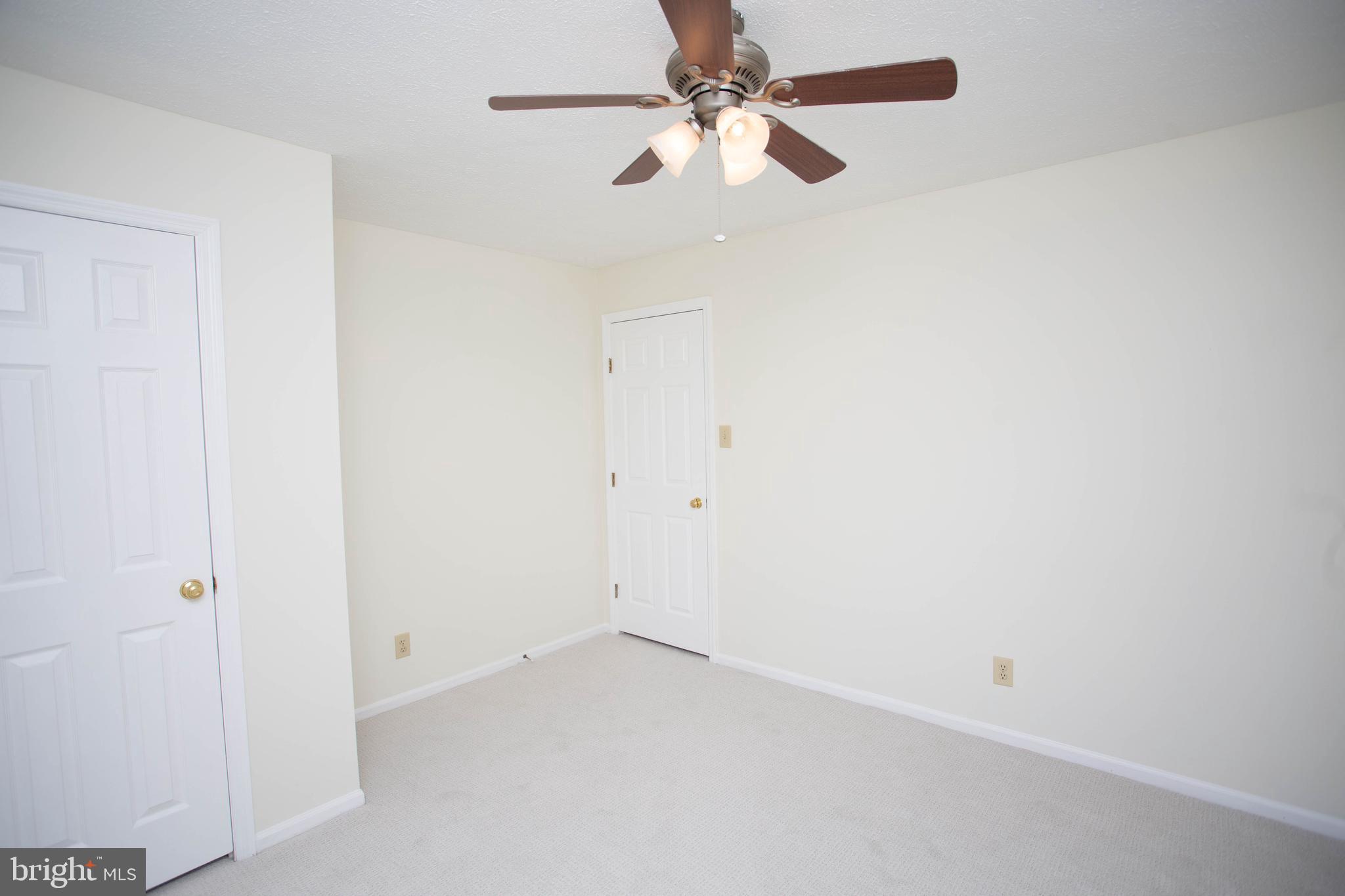 143 Rambling Road Lumberton, NJ 08048 - Photo 32 of 54 an empty room with a window and a fan