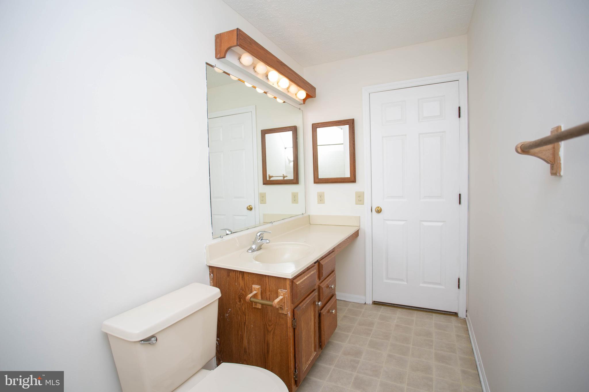 143 Rambling Road Lumberton, NJ 08048 - Photo 33 of 54 a bathroom with a sink toilet vanity and mirror