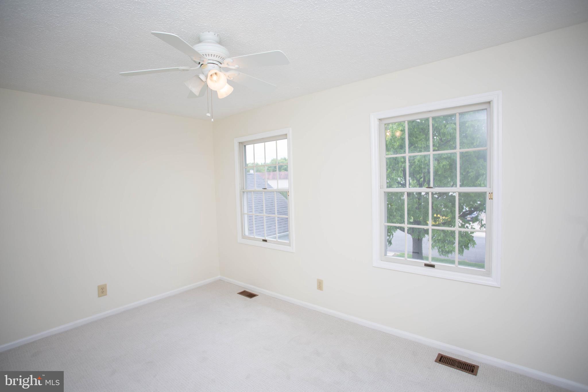 143 Rambling Road Lumberton, NJ 08048 - Photo 36 of 54 an empty room with a window and a ceiling fan