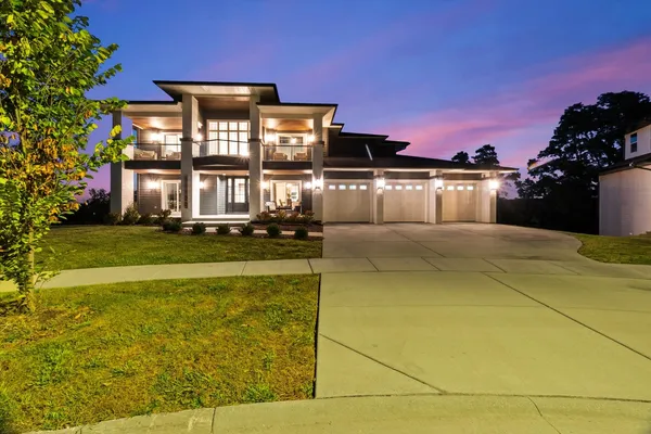 a view of a big house with a big yard