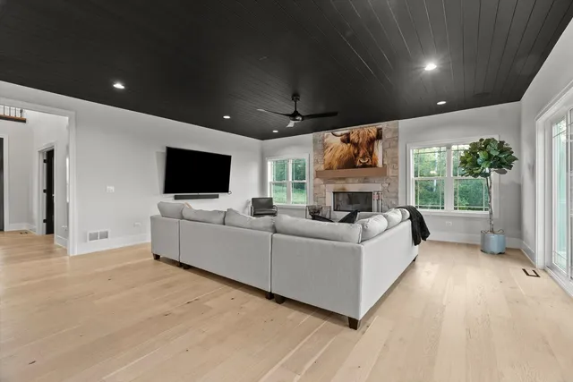 a kitchen with stainless steel appliances granite countertop a sink a stove and a refrigerator