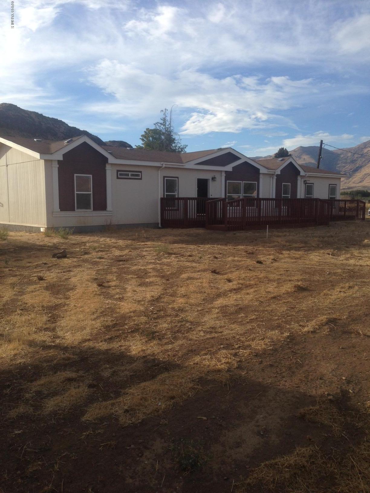 100 Ranger Road Naches, WA 98937 - Photo 1 of 10 a front view of a house with a yard