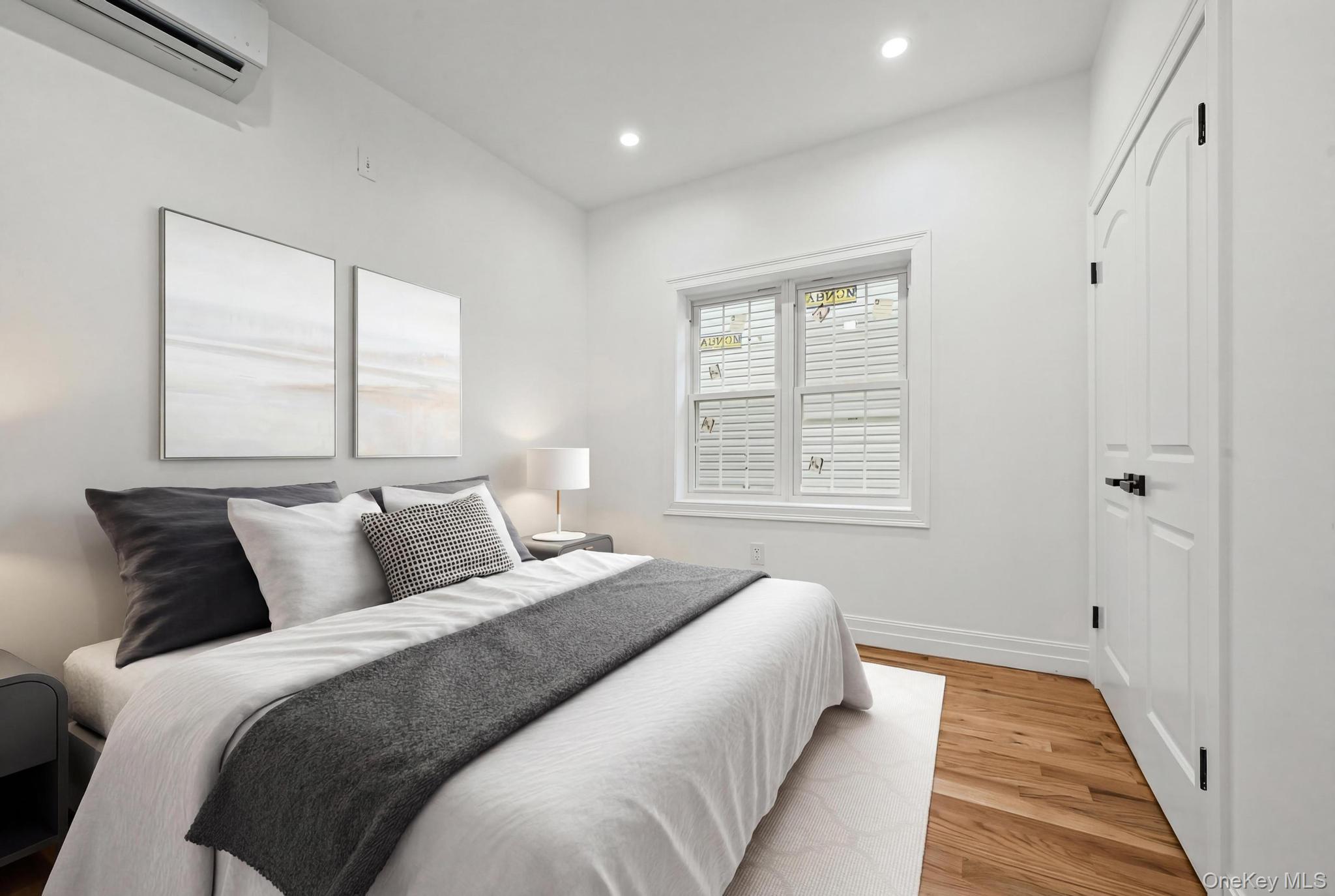 160-15 118th Road Queens, NY 11434 - Photo 15 of 23 a bedroom with bed and a window