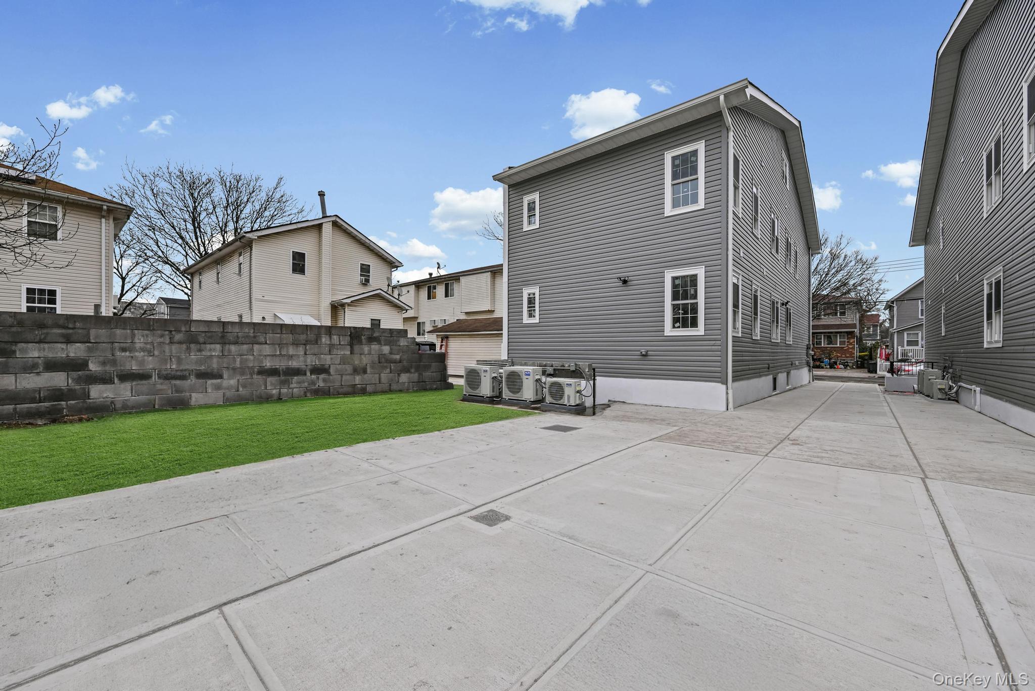 160-15 118th Road Queens, NY 11434 - Photo 4 of 23 a front view of a house with a yard
