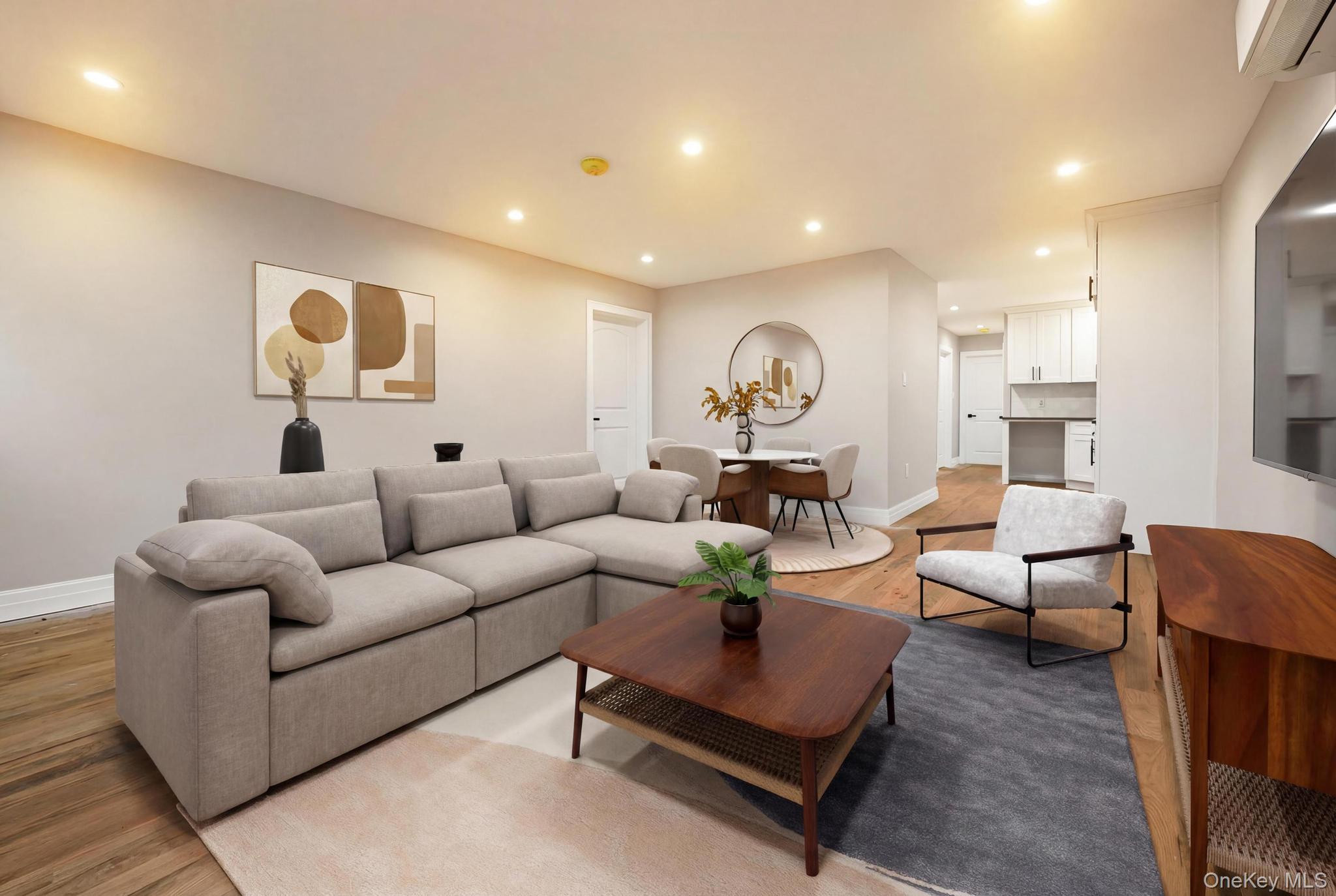 160-15 118th Road Queens, NY 11434 - Photo 5 of 23 a living room with furniture and a wooden floor