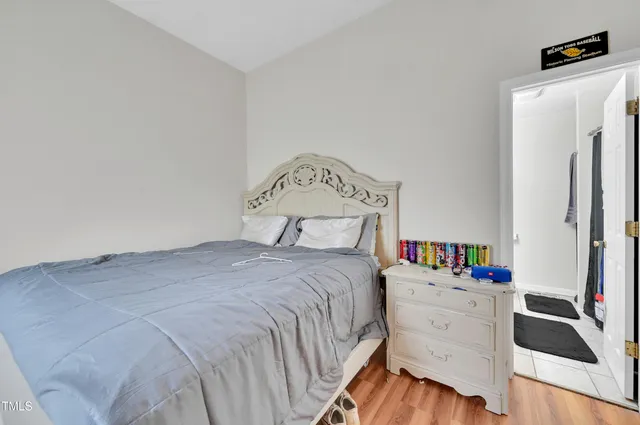 a bedroom with a bed and a closet