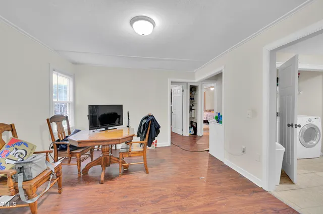 a view of a livingroom with furniture and a flat screen tv