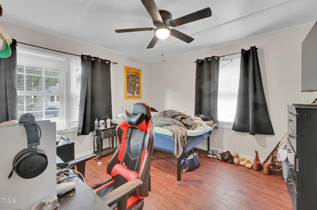 a view of a livingroom with furniture and a flat screen tv